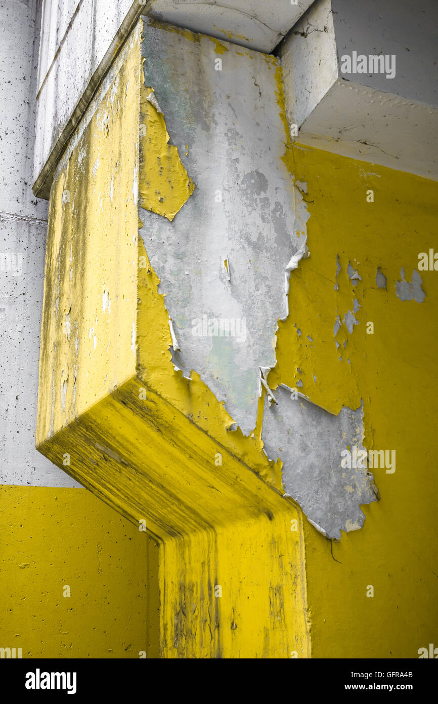 Close up of an old pillar with yellow peeling paint Stock Photo Alamy
