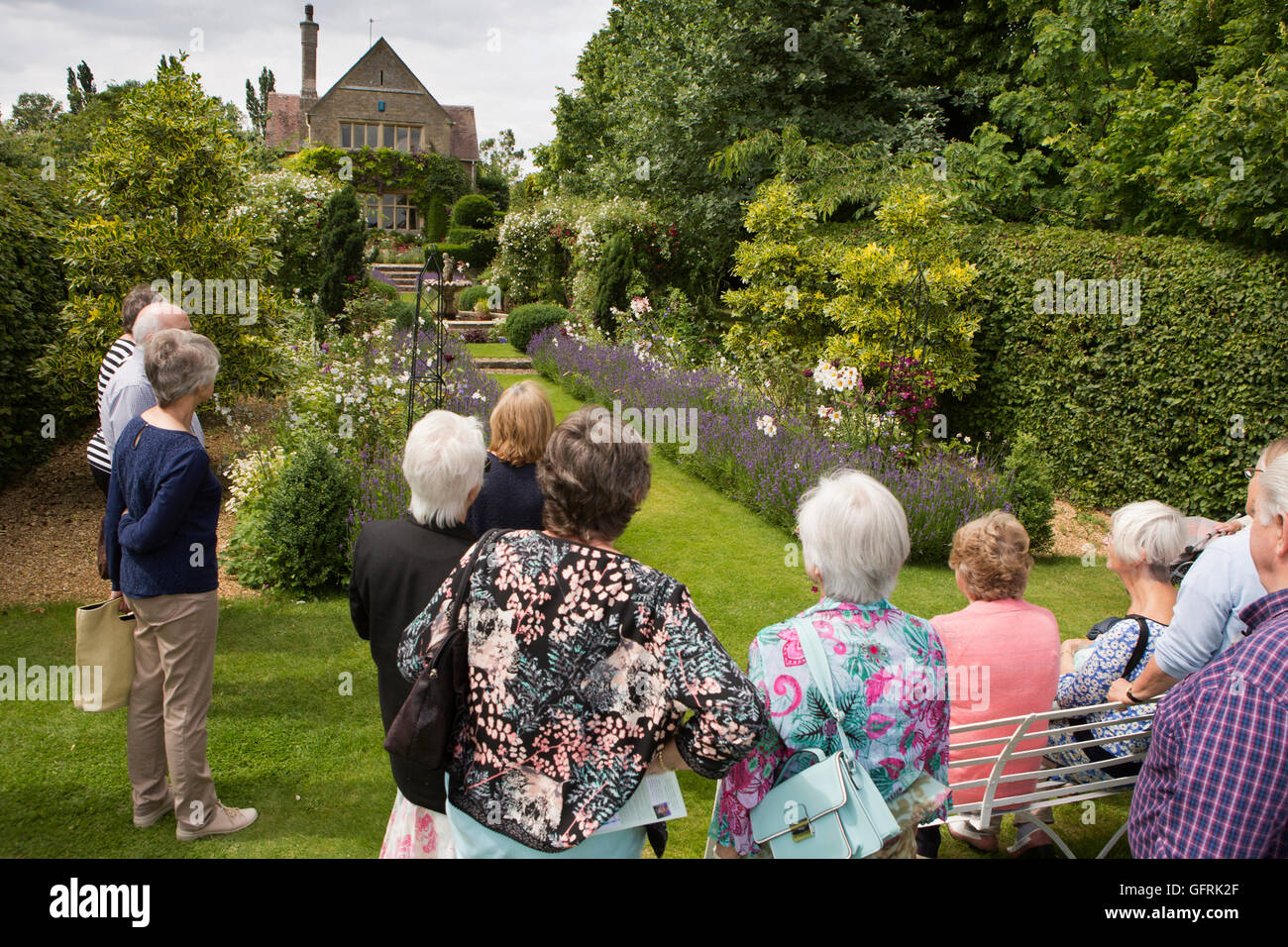 UK, England, Bedfordshire, Stevington, Kathy Brown’s garden, visitors in terrace garden Stock Photo