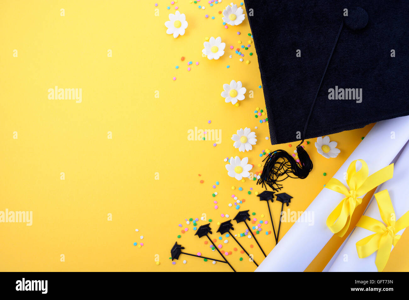 Yellow black and white theme graduation background with decorated borders on yellow background. Stock Photo