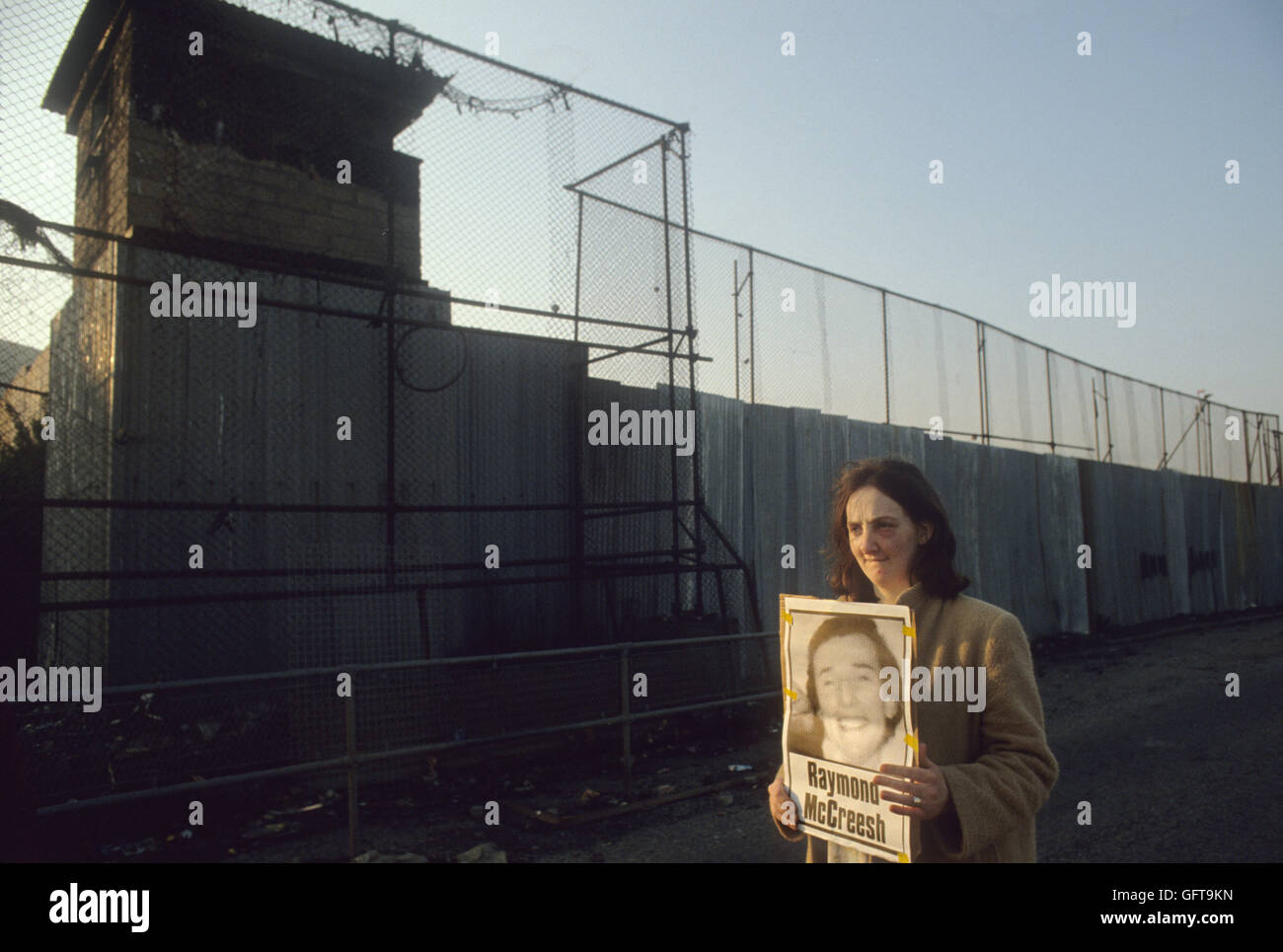 Hunger striker Raymond McCreesh poster, woman protesting outside of the Long Kesh Detention Centre, also known as the H-Blocks or and  HM Prison Maze, Lisburn Northern Ireland 1981 1980s UK HOMER SYKES Stock Photo