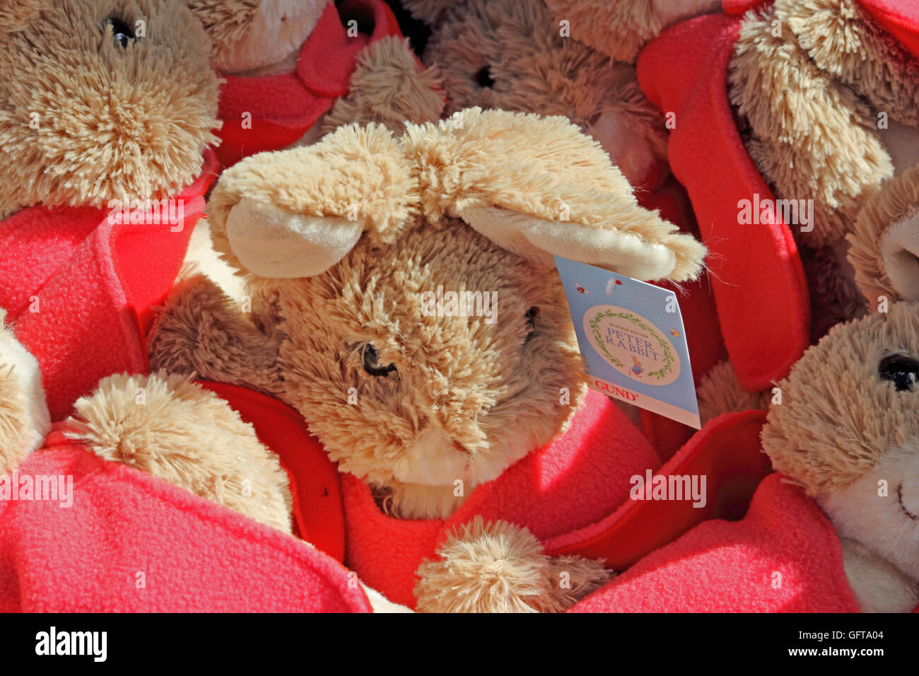 Basket of Beatrix Potter Peter Rabbit character dolls Stock Photo