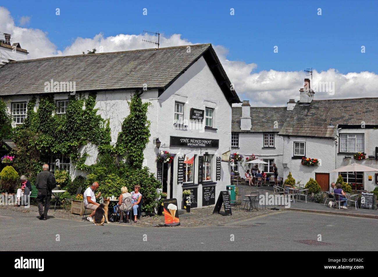 The Honeypot food shop and Kings Arms Hotel in centre of Hawkshead village, Cumbria Stock Photo