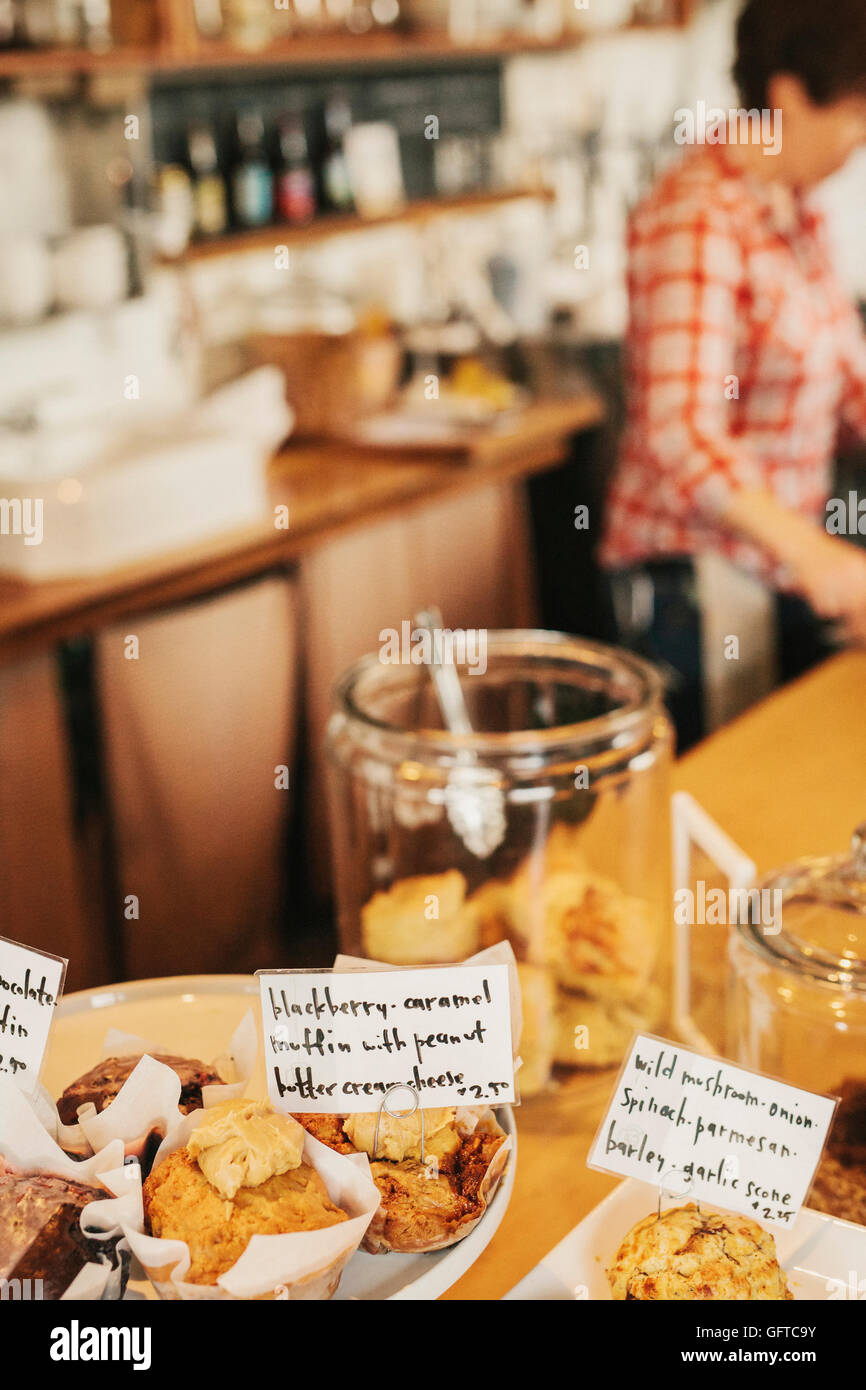 Freshly prepared food on the counter of a small coffee shop and restaurant Hand written labels on the dishes Stock Photo
