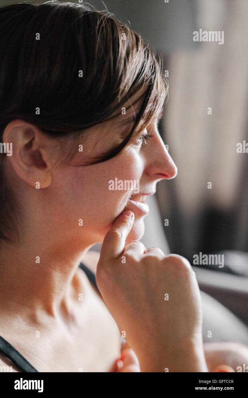 Woman hand on chin hi-res stock photography and images - Alamy