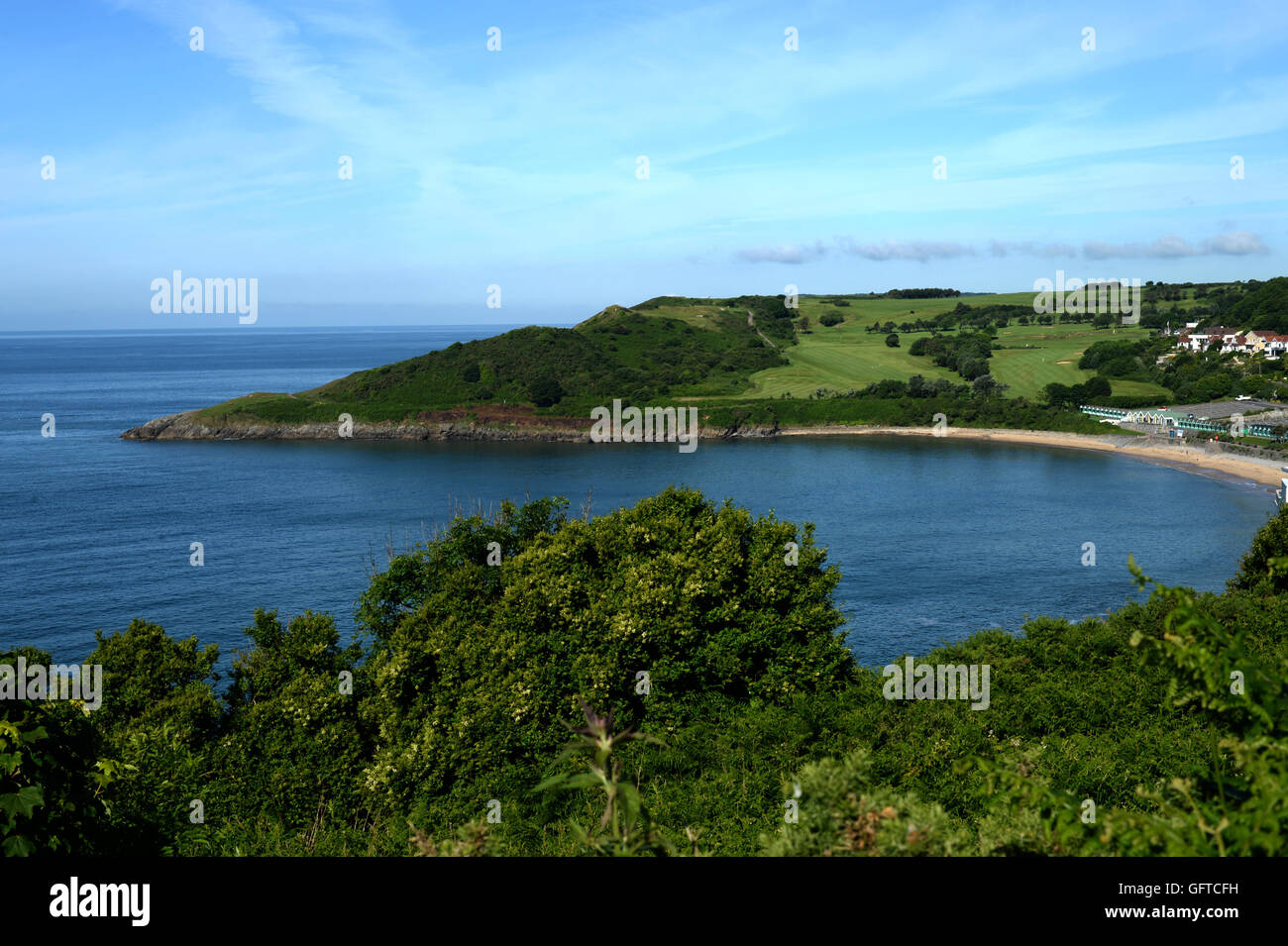 coast path views of sheltered sandy bay and headlands at Langland