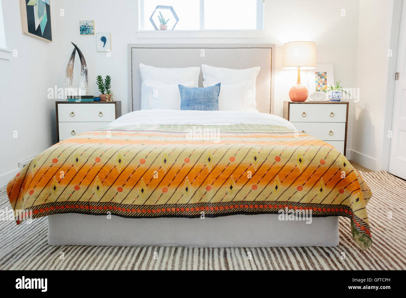 A bedroom in an apartment with a double bed and a retro look antique ...