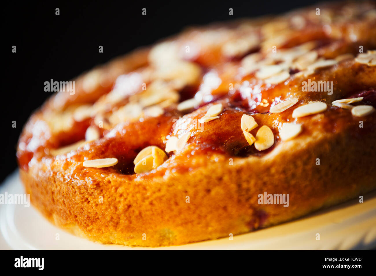 A fresh baked tart with almonds on the top Stock Photo