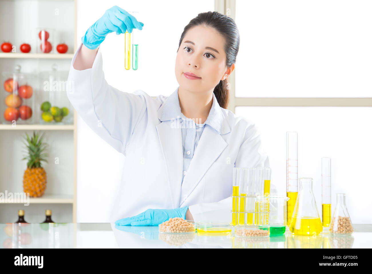 gmo chemistry researchers observing indicator color shift test Stock Photo
