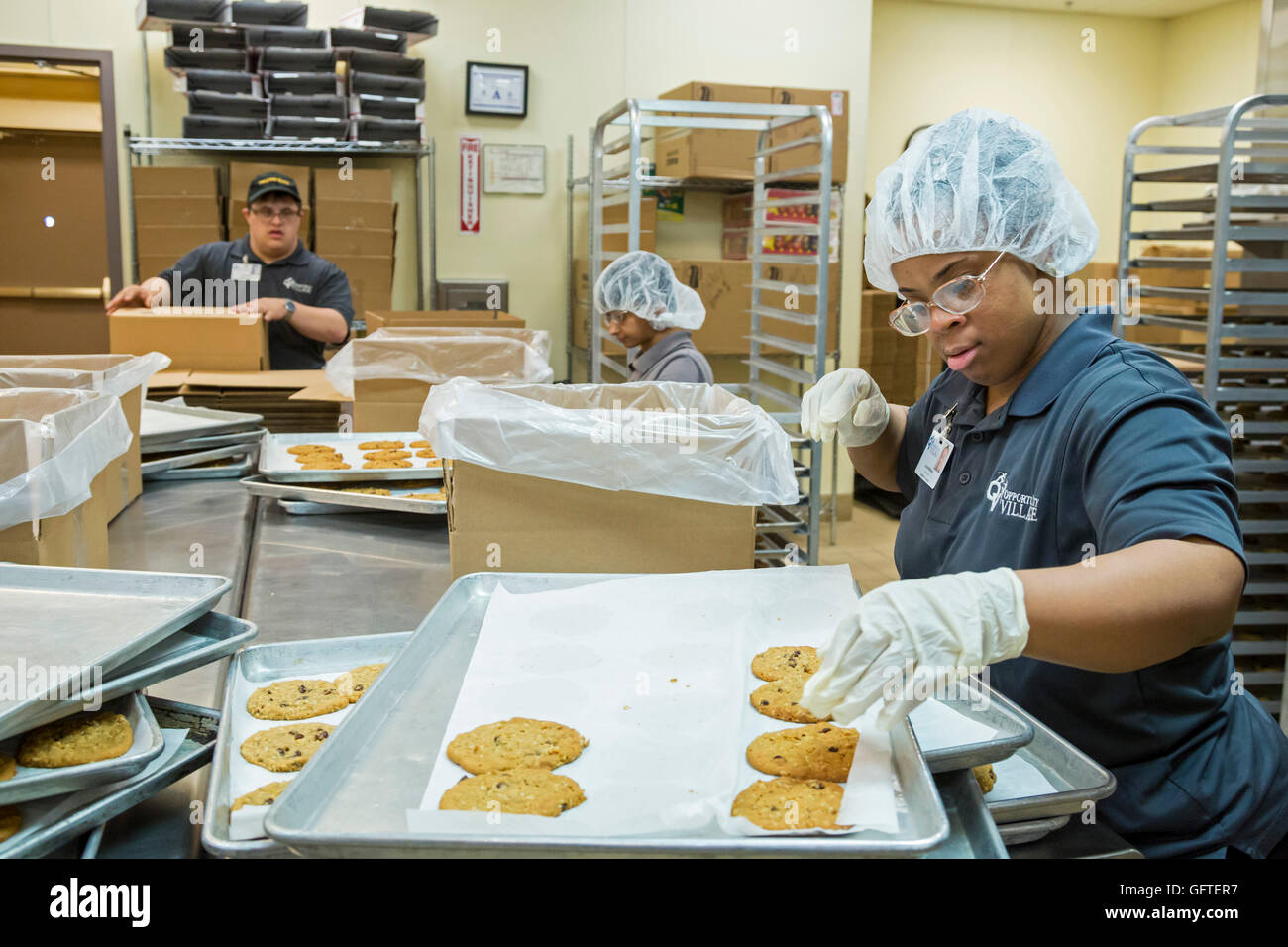Las Vegas, Nevada - People with intellectual disabilities bake and package cookies for sale at the nonprofit Opportunity Village Stock Photo