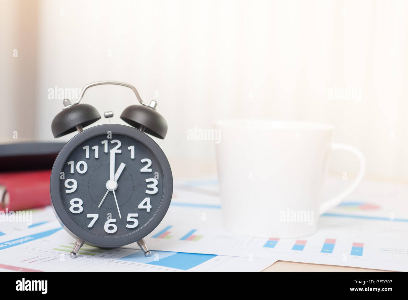 Vintage background with retro alarm clock on table Stock Photo - Alamy
