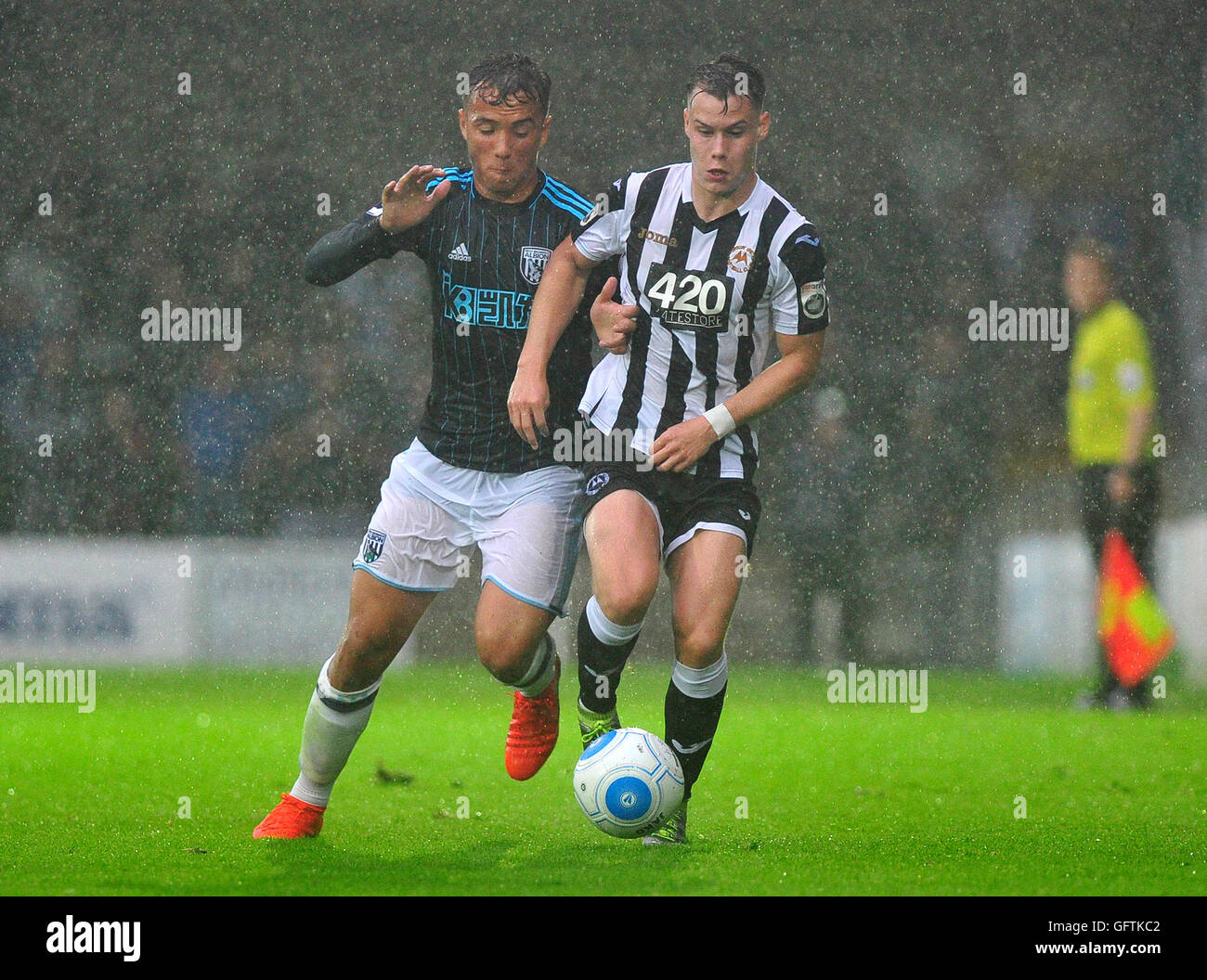 West Bromwich Albion's Kane Wilson (left) and Torquay United's San Chaney during the pre-season friendly match at Plainmoor, Torquay. Stock Photo