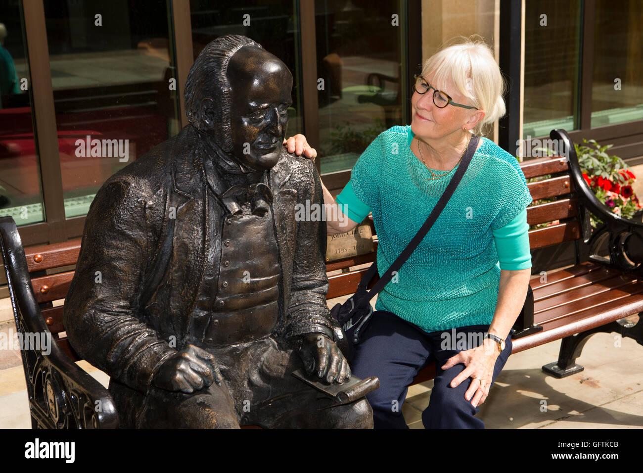 UK, England, Northamptonshire, Northampton, Guildhall, woman tourist with statue of Peasant’s Poet John Clare by Richard Austin Stock Photo