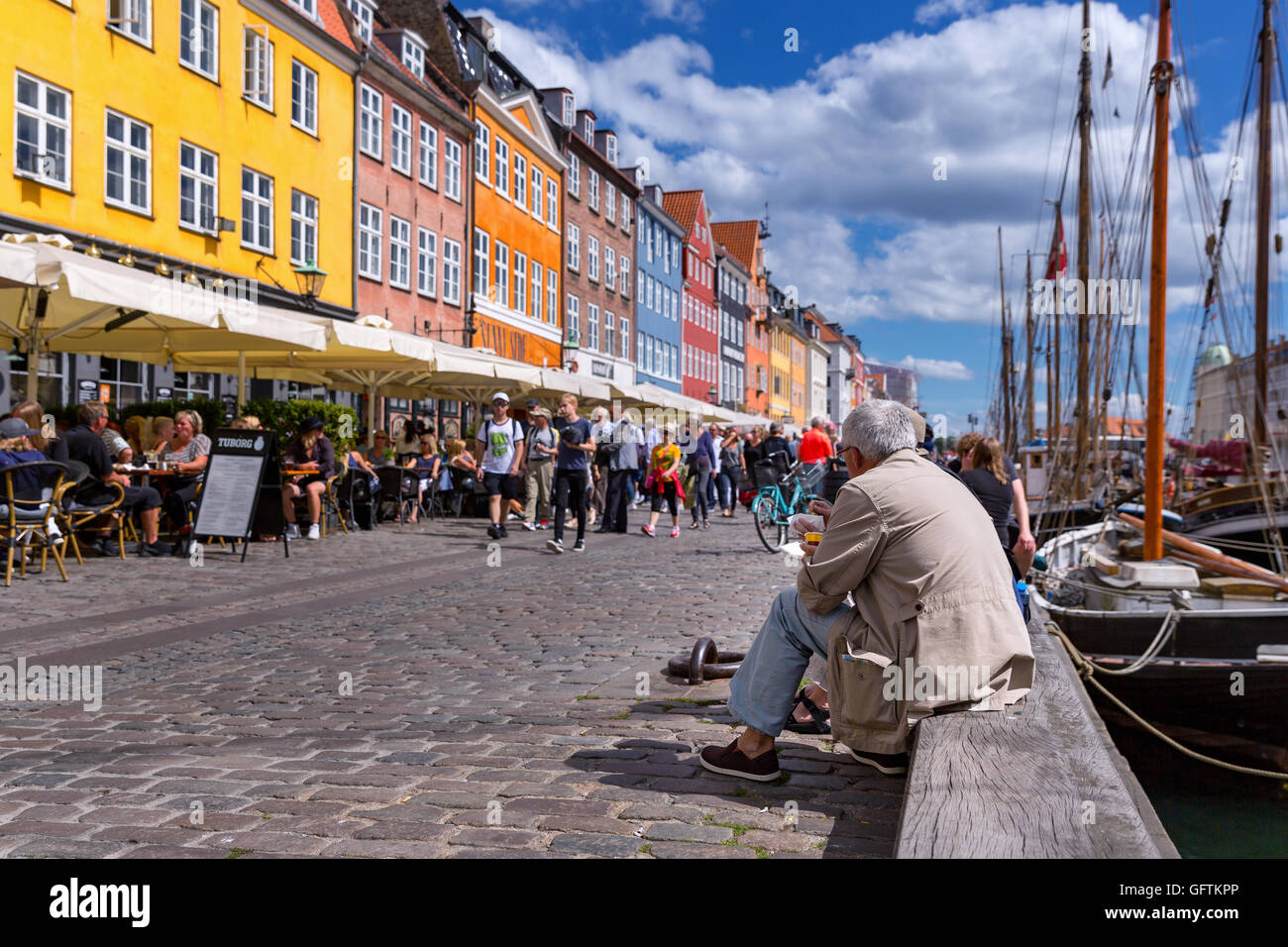 People in Nyhavn, Copenhagen, Denmark Stock Photo