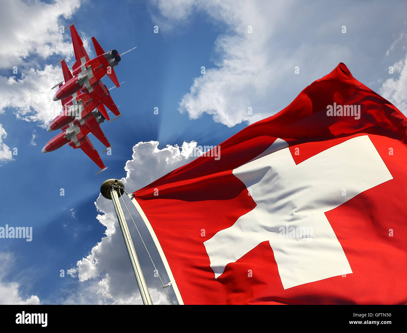Switzerland national day background: Swiss flag and military fighter jets against blue sky with white clouds and sun rays Stock Photo