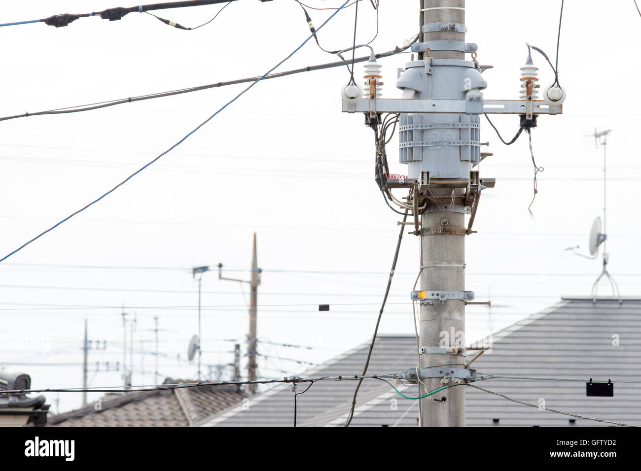 Japanese voltage inverter on the power pole in town Stock Photo