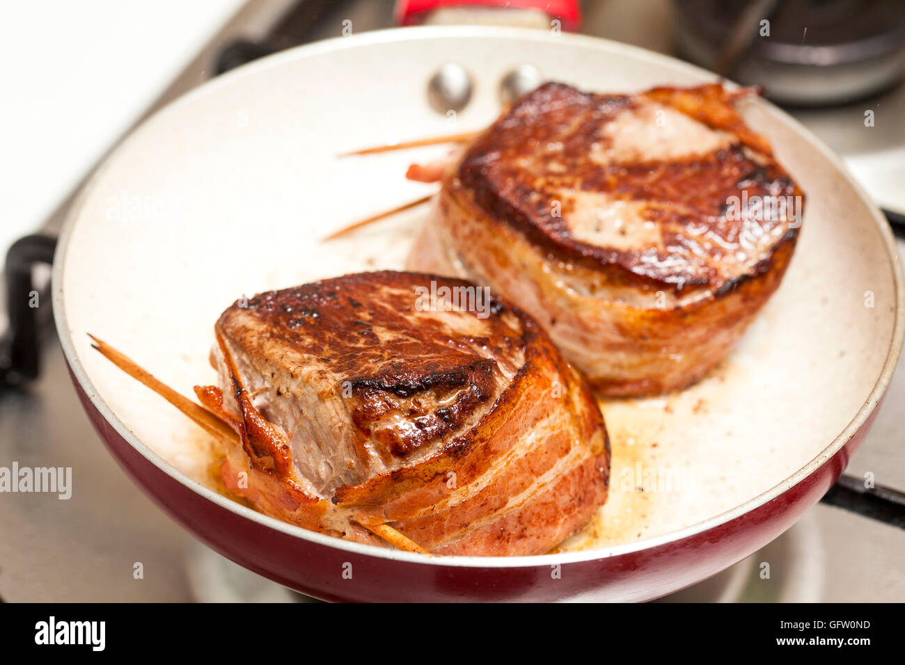 Searing and cooking beef tenderloin medallions Stock Photo