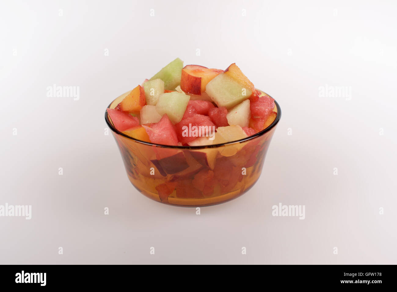 Fruit salad in glass on a white background Stock Photo - Alamy
