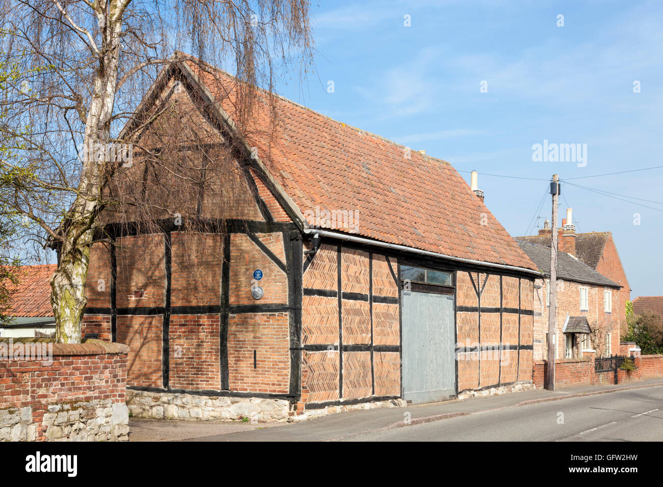 Timber framed brick barn in the village of Hoton, Leicestershire, England, UK Stock Photo