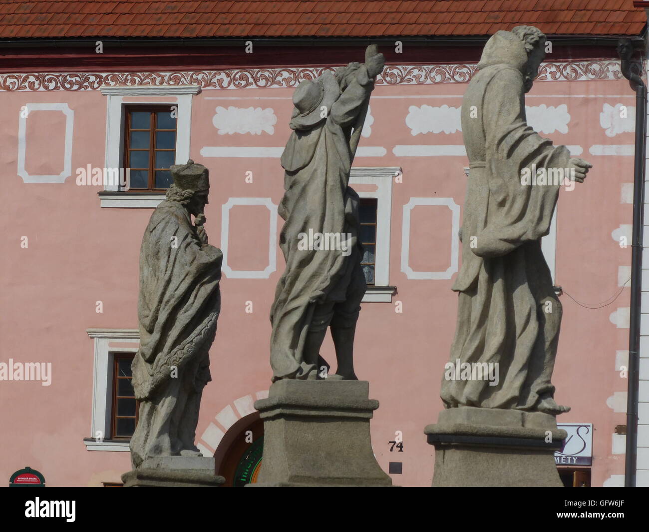 Three stone statues Stock Photo Alamy