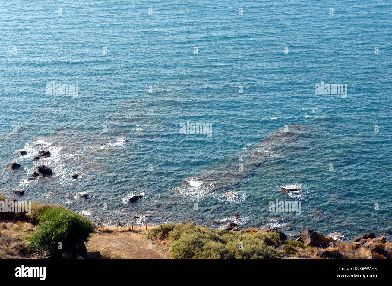 blue sea breaking on the rocks Stock Photo - Alamy