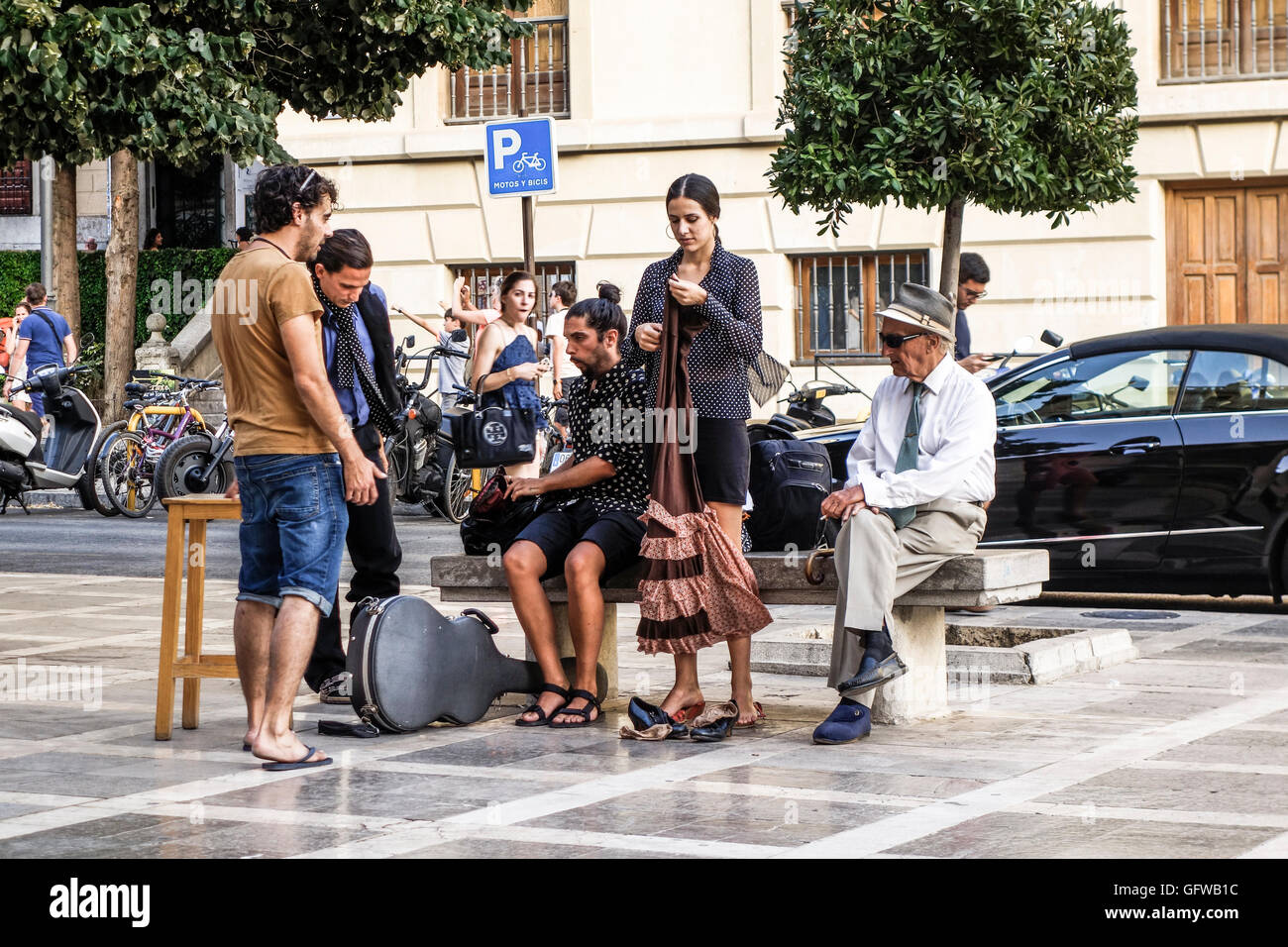 Group of street musicians, flamenco, dancing, preparing a show, Granada, Spain. Stock Photo