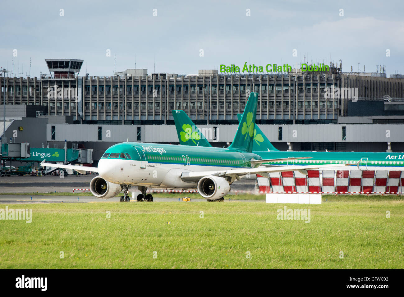 Aer Lingus plane on the tarmac at Dublin airport with Dublin airport