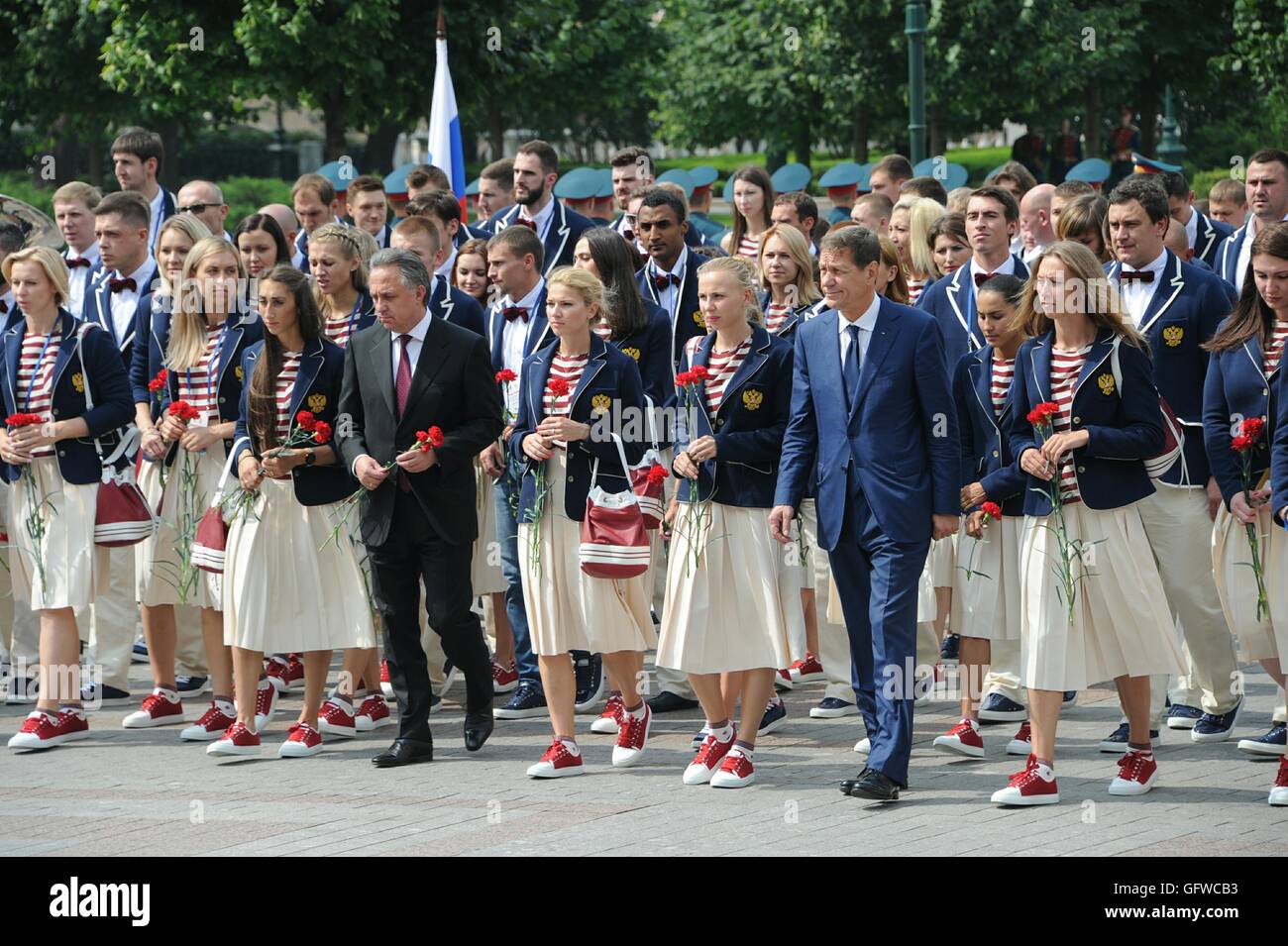 July 27, 2016. - Russia, Moscow. - Russian Sports Minister Vitaly Mutko (left), President of the Russian Olympic Committee Aleksander Zhukov (right) and members of the Russian national Olympic team laying flowers at the Eternal Flame in the Alexander Garden. Stock Photo