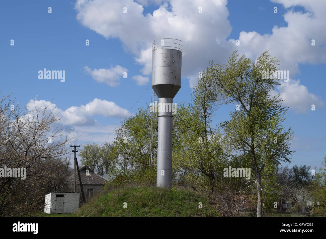 Rusty water tower. An old rustic communal communication Stock Photo - Alamy