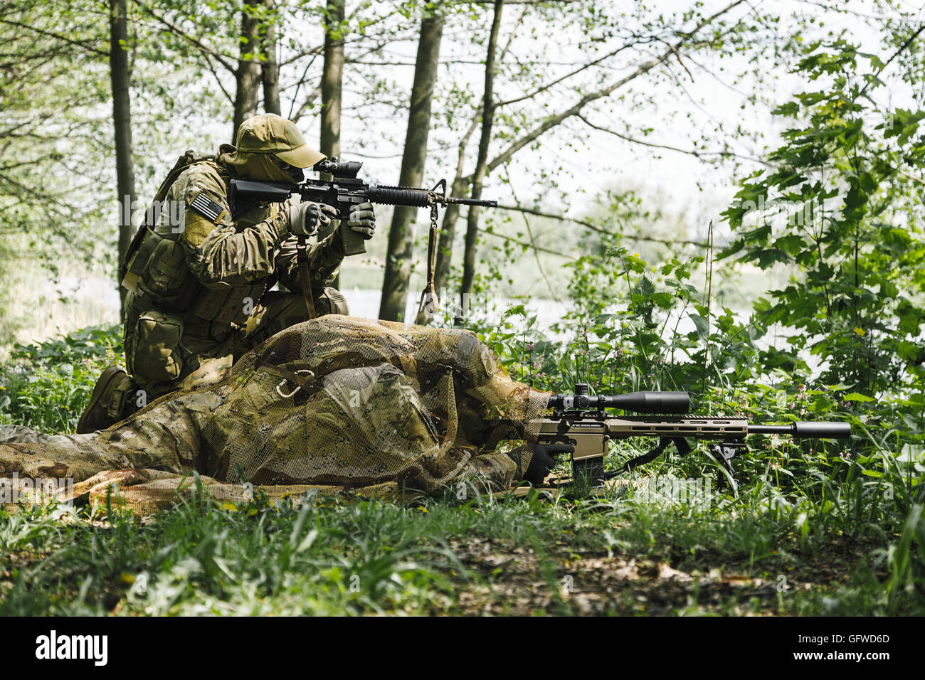 Sniper and spotter of Green Berets Stock Photo