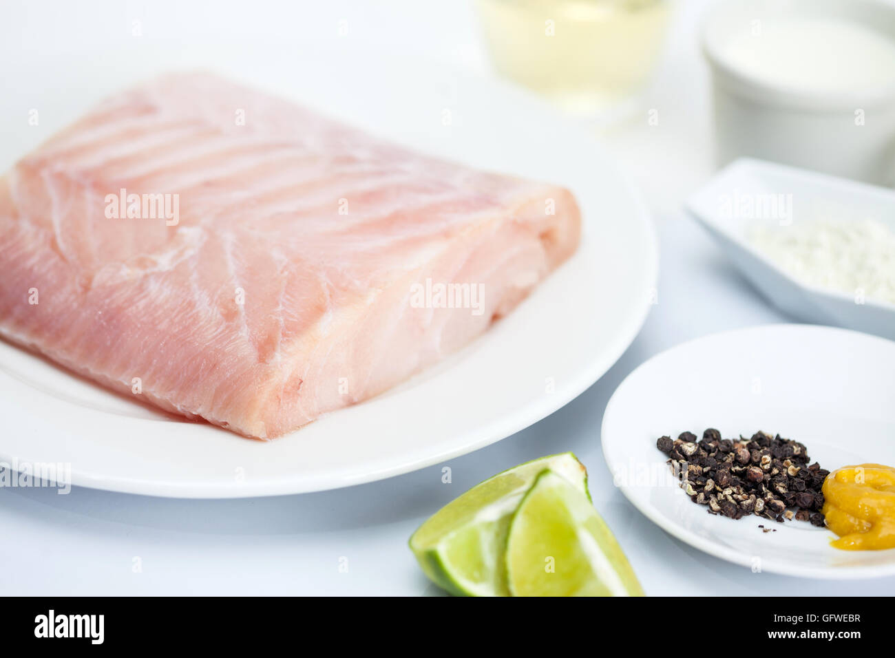 Ingredients to prepare a sea bass fillet Stock Photo Alamy