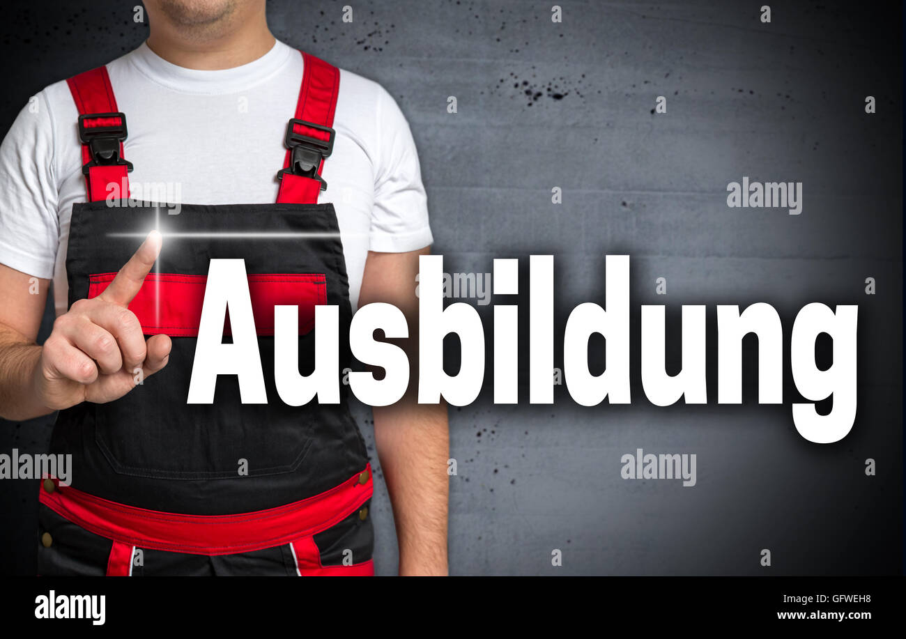 Ausbildung (in germanTraining Staff) touchscreen is shown by craftsman. Stock Photo