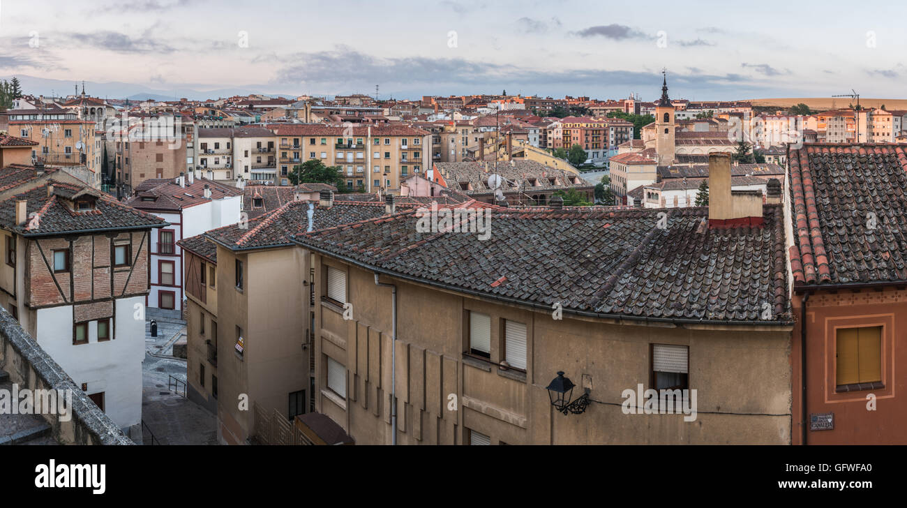 Panorama during sunrise over Segovia, Spain. Olderst viaduct in the country is the biggest landmark. Stock Photo