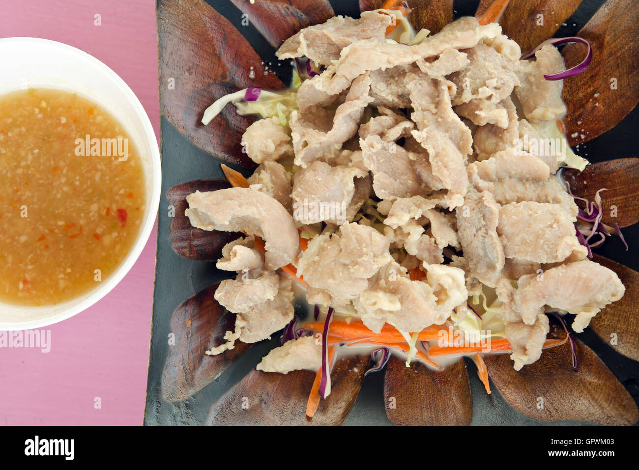 Pork and vegetables with lime sauce – famous thai local food menu Stock Photo