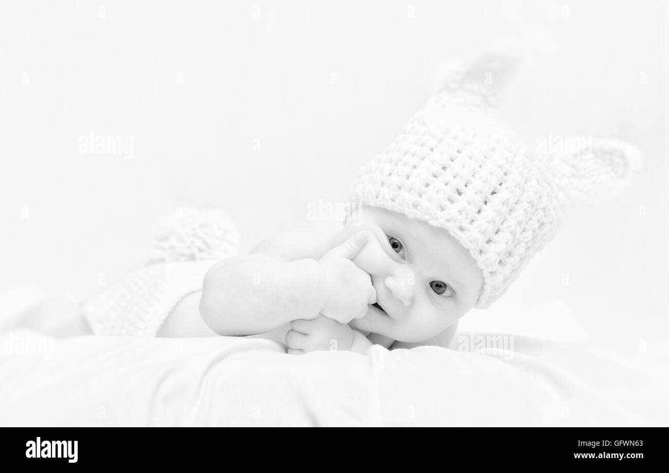 newborn with bunny hat highkey image Stock Photo
