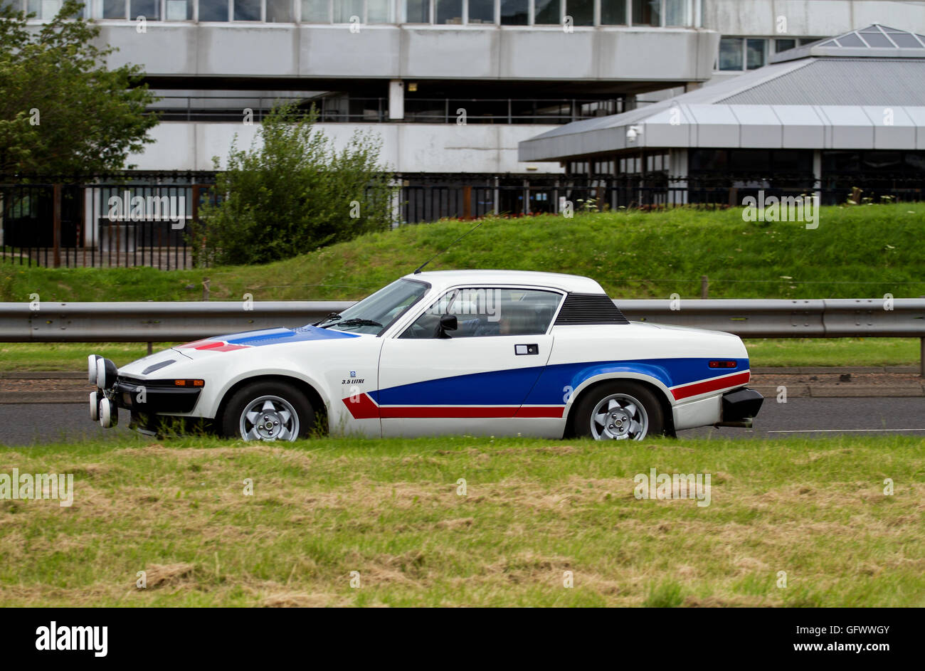 A British Leyland Triumph TR-7 sports car travelling along the Kingsway Dual Carriageway in Dundee, UK Stock Photo