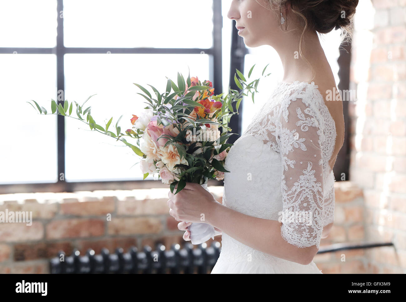 Bride looking into church hi-res stock photography and images - Alamy