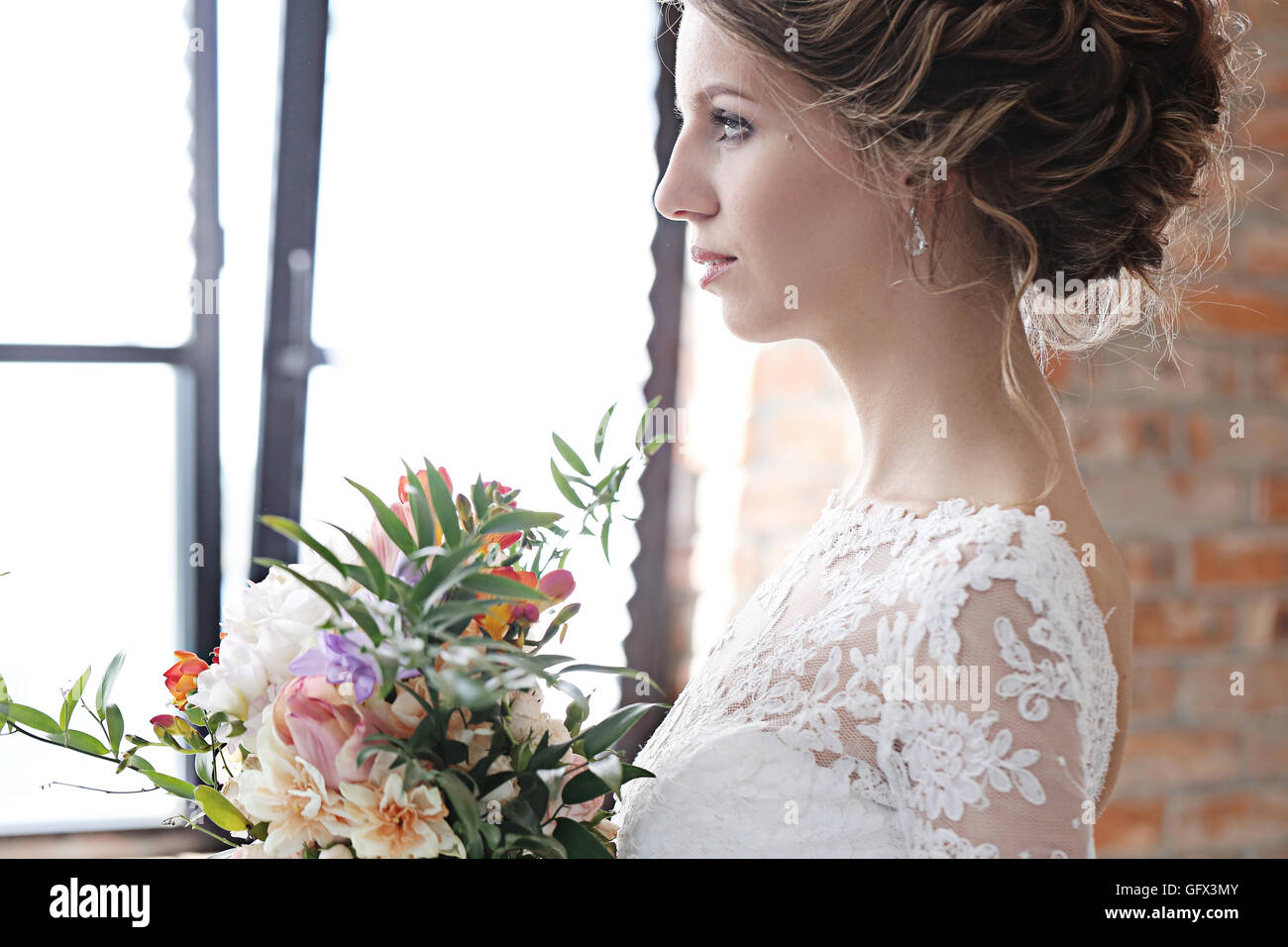 Bride looking into church hi-res stock photography and images - Alamy