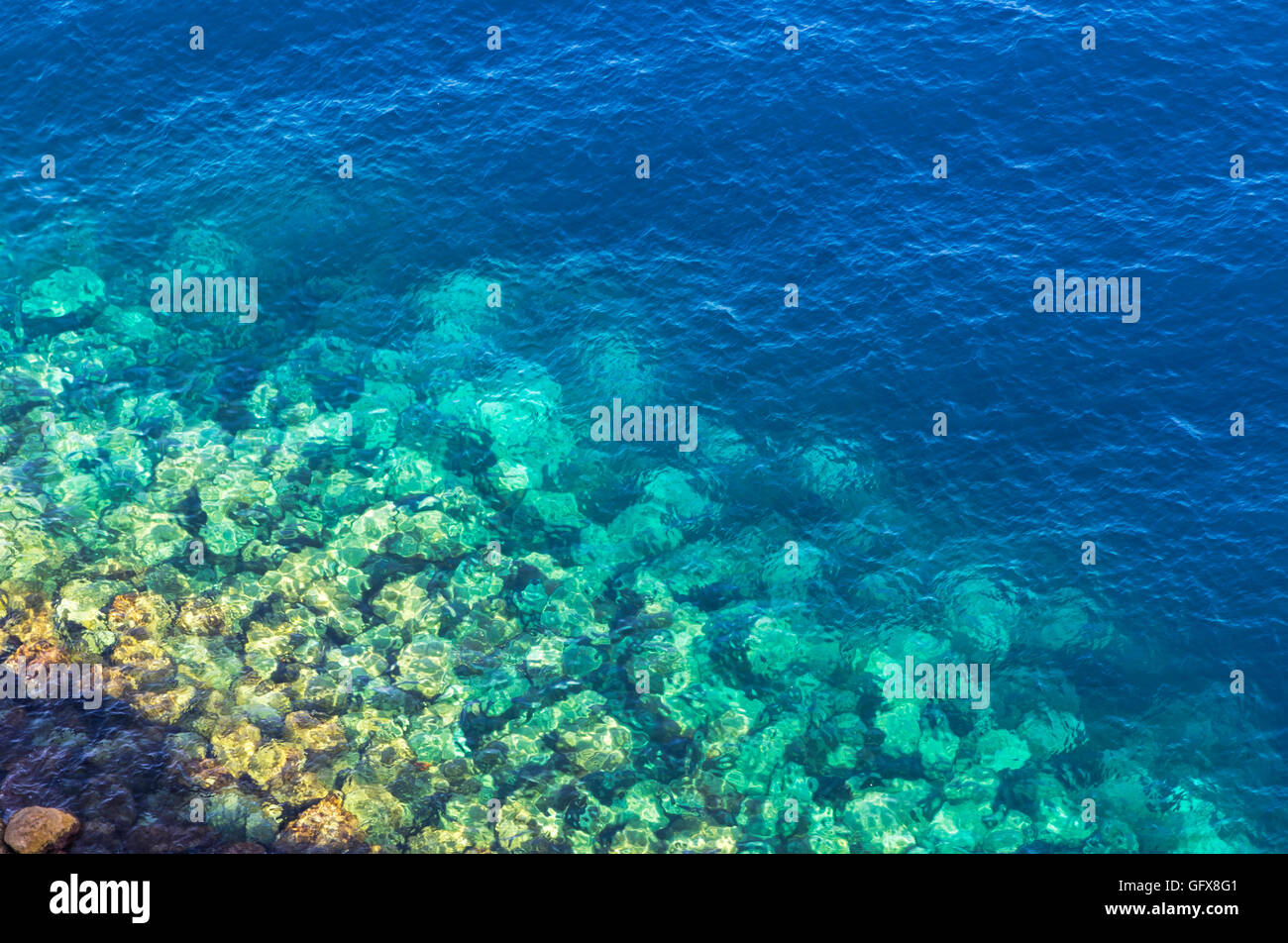 Background made of clear azure and blue sea water. View from above Stock Photo