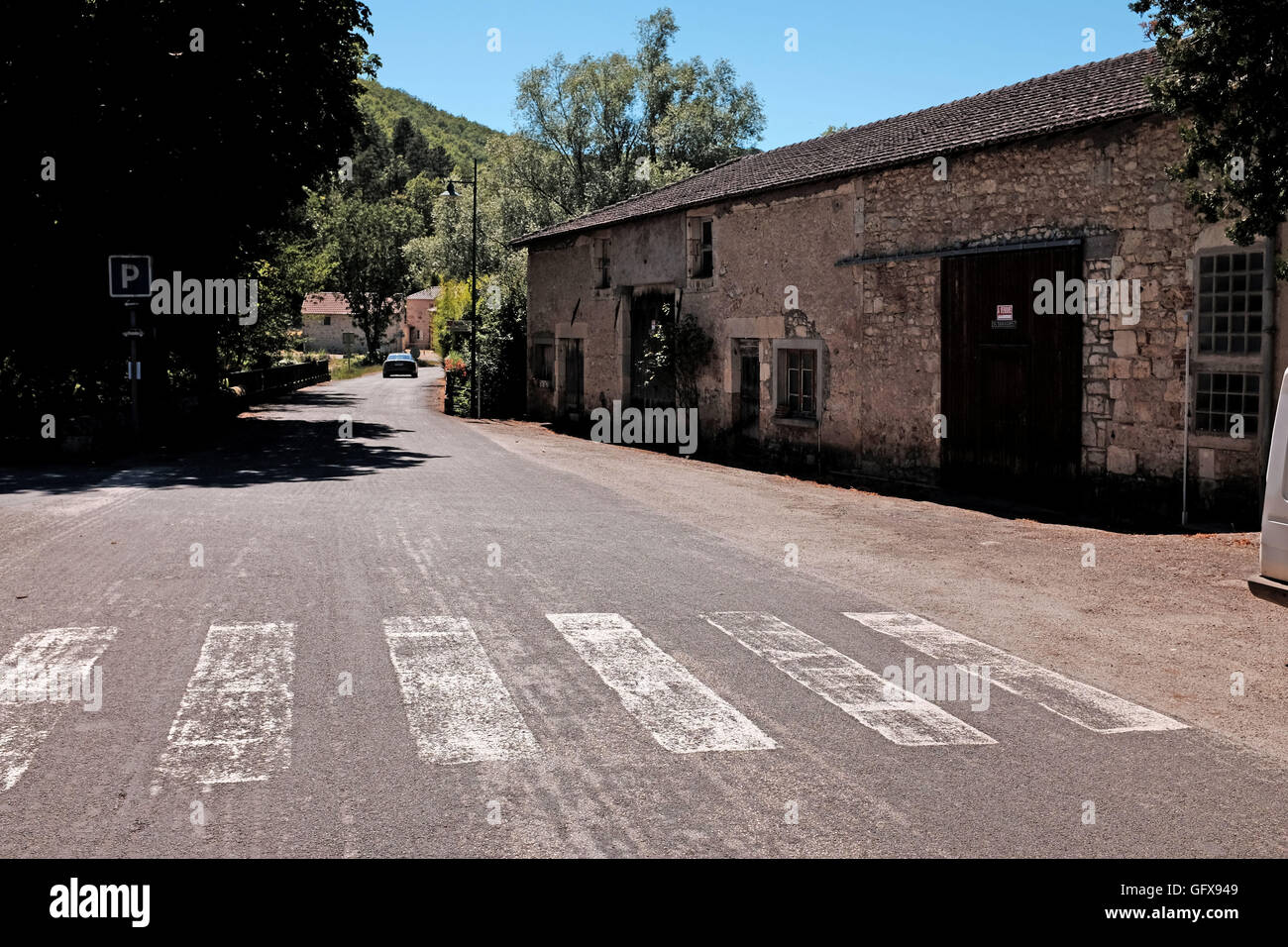 Quiet road through village of Grezels in Lot Region of France Europe Stock Photo