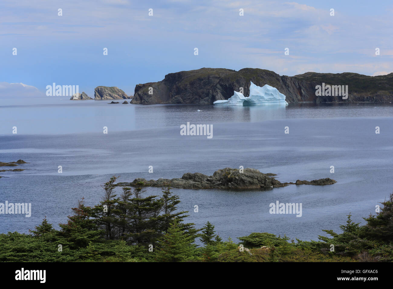 A jagged iceberg on the scenic coast of Twillingate Harbour, North Twillingate Island, Newfoundland and Labrador, Canada. Stock Photo