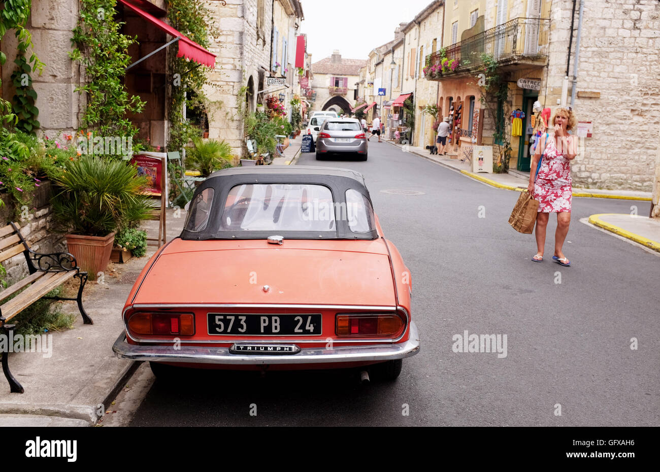 Old Triumph Spitfire parked in The bastide of Monpazier in Dordogne region of France Europe Stock Photo