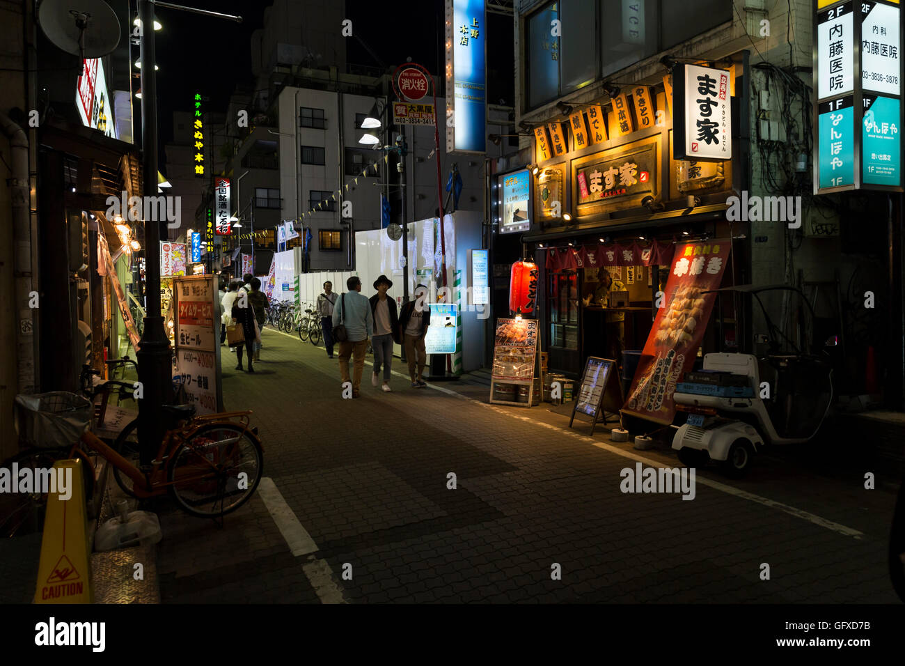 Nightlife with illuminated advertising in the side streets around the Ueno train station in Tokyo, Japan Stock Photo