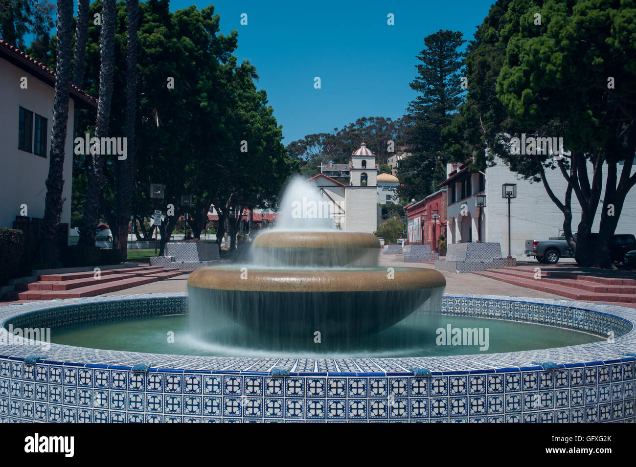Silky water of Ventura fountain wile looking toward Mission Stock Photo