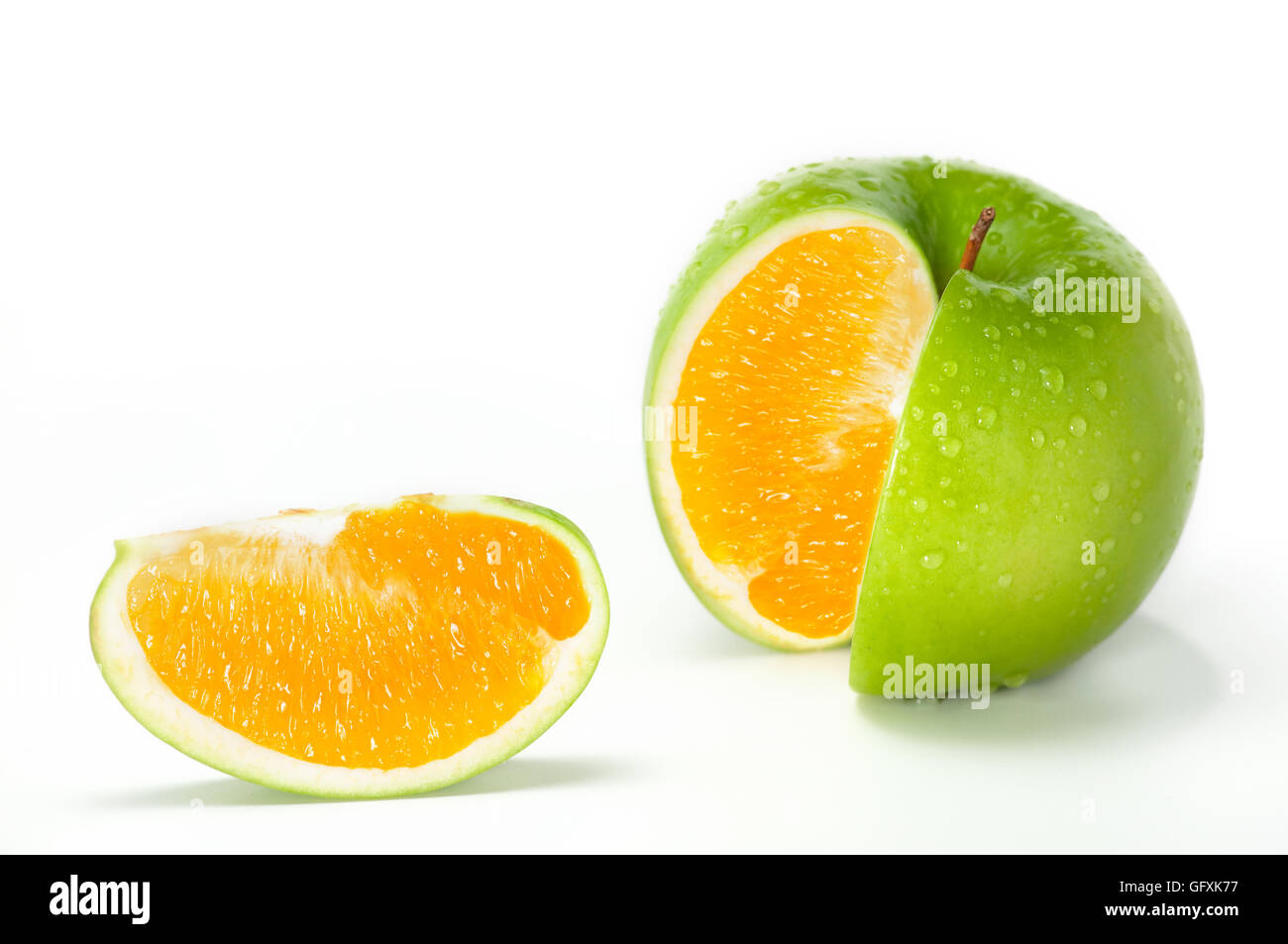 Apple Orange Hybrid. Close-up image of fresh green apple combined with orange. Stock Photo