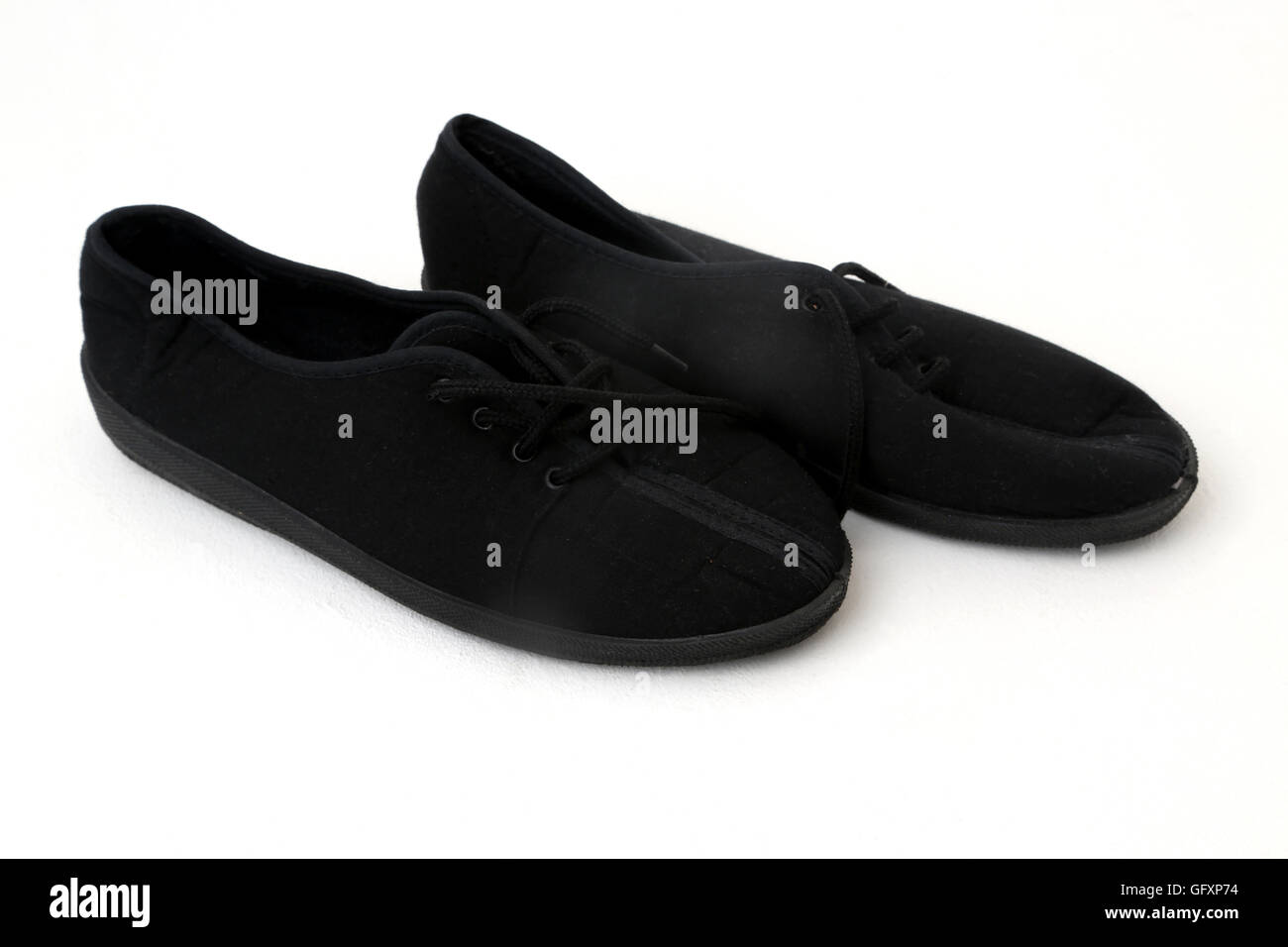 A Pair Of Black Plimsole Stock Photo