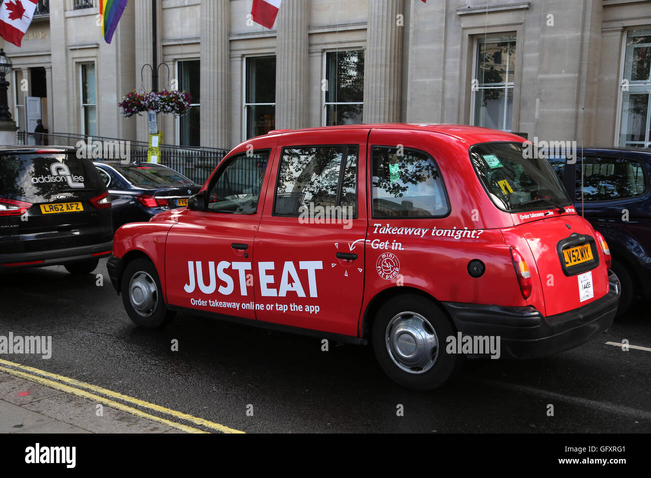 London England Trafalgar Square Red Taxi Outside Canada House Stock Photo