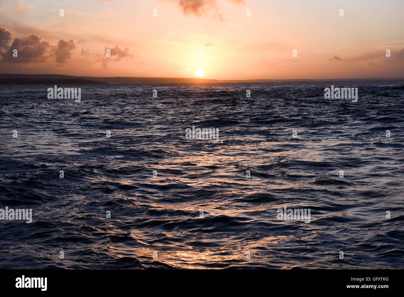 Sunrise over the Atlantic coast in Mousehole in Cornwall,UK Stock Photo ...
