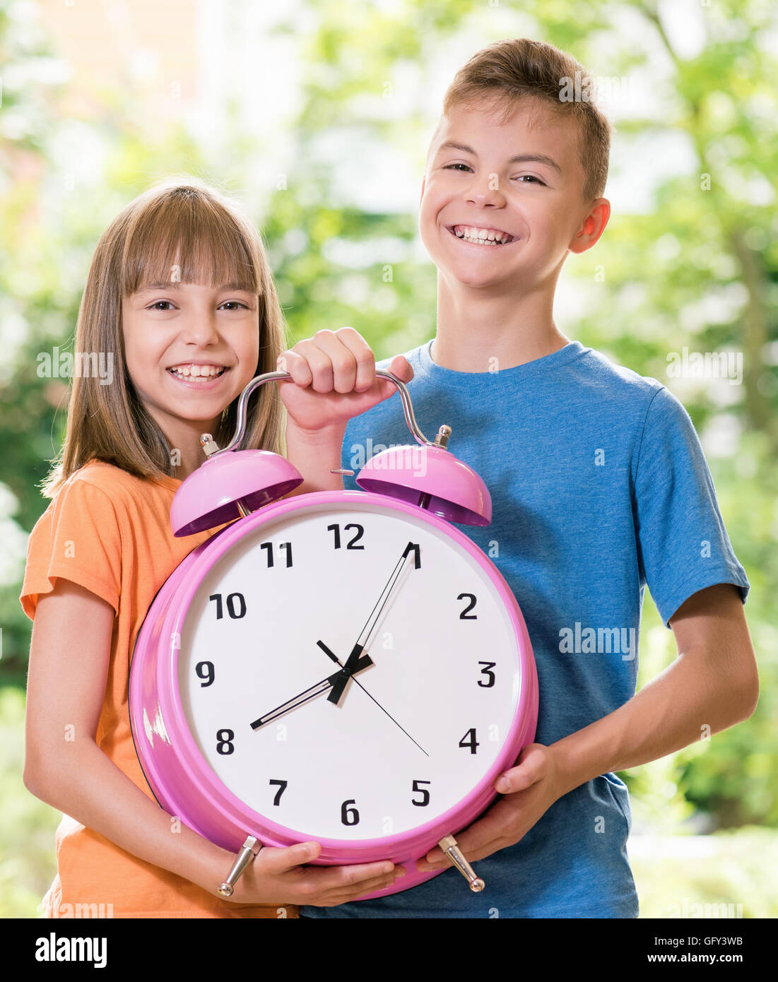 Children with big clock Stock Photo