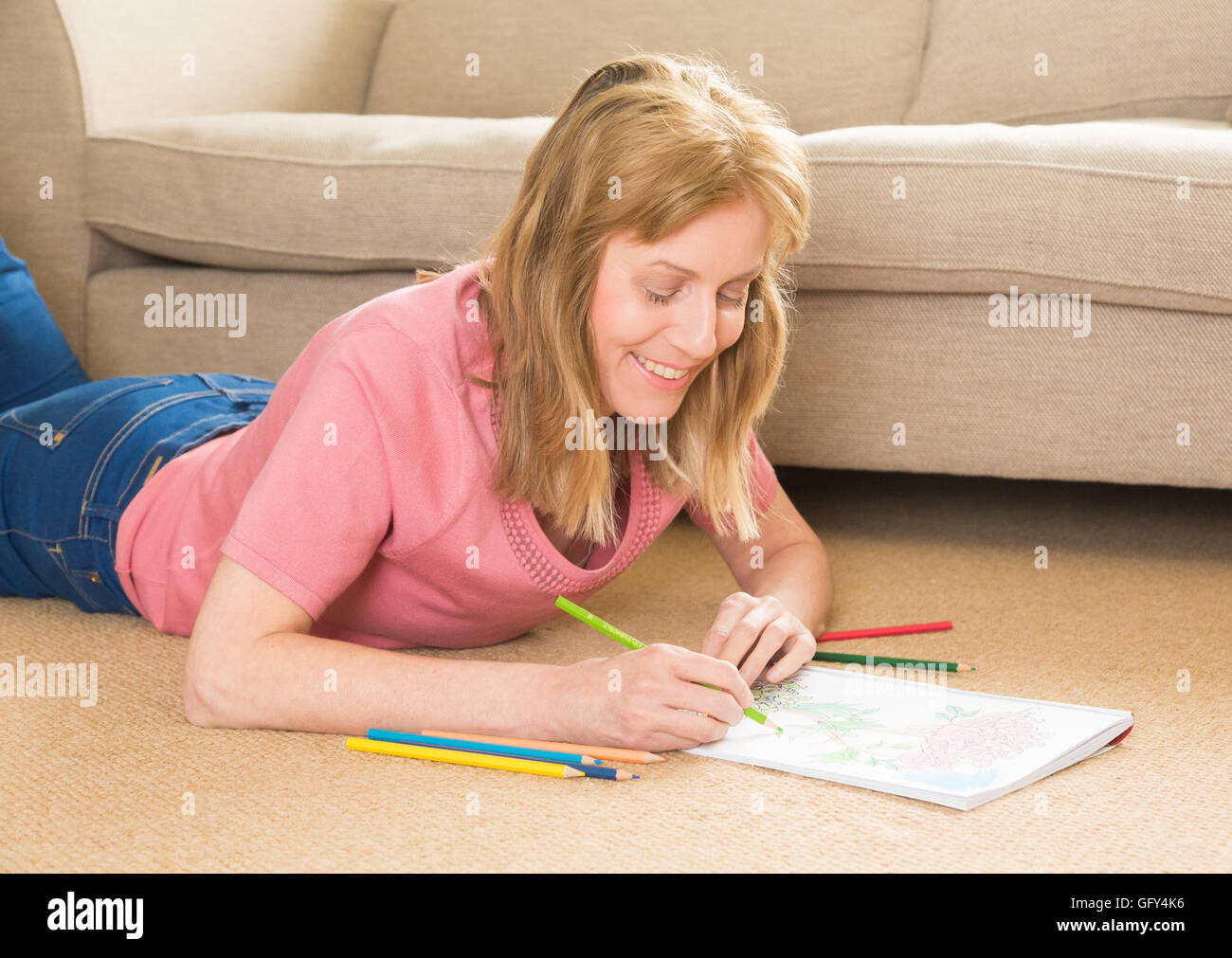 woman colouring in a book Stock Photo