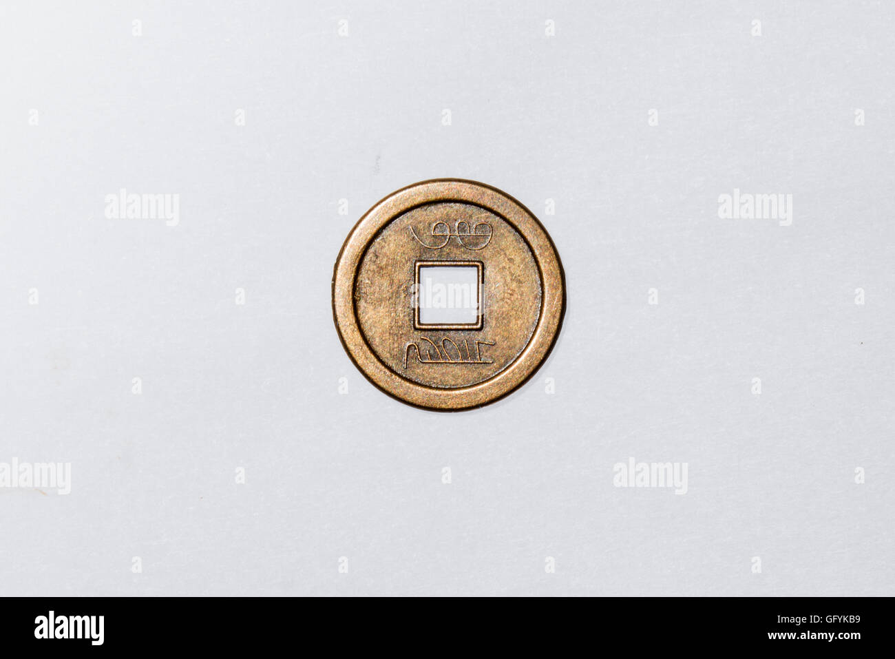 ancient chinese coin isolated on white background Stock Photo